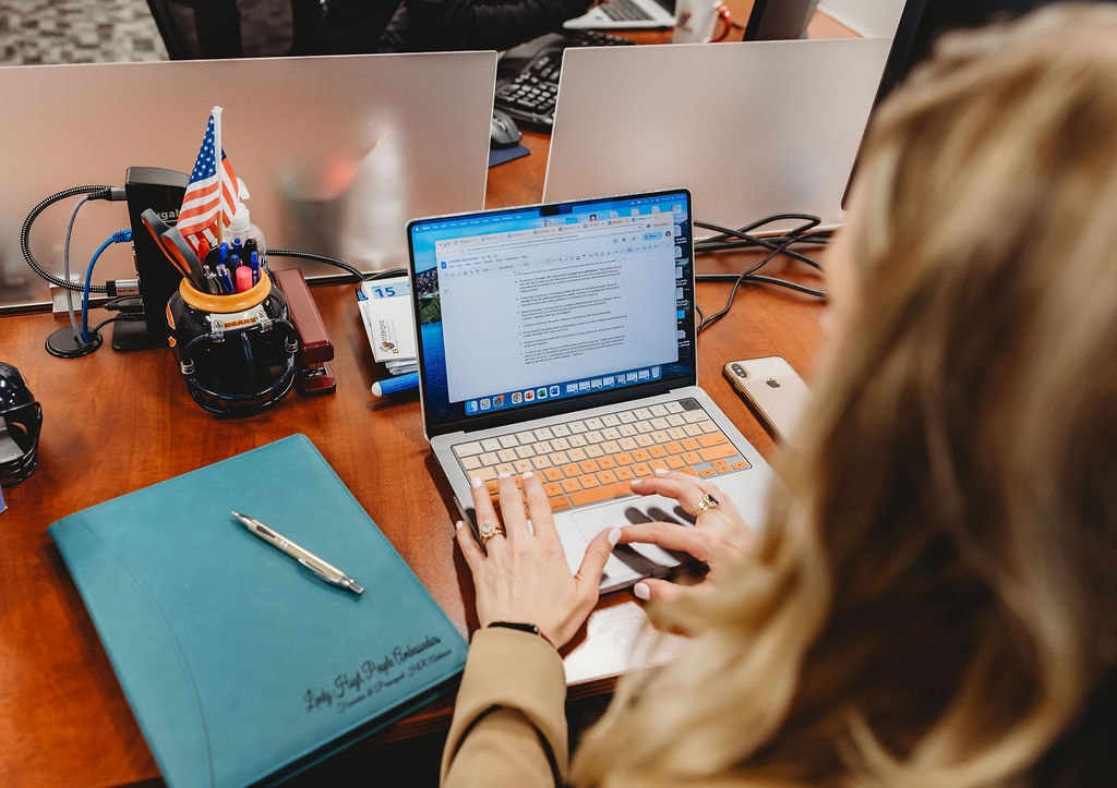 woman working on computer ai translation services